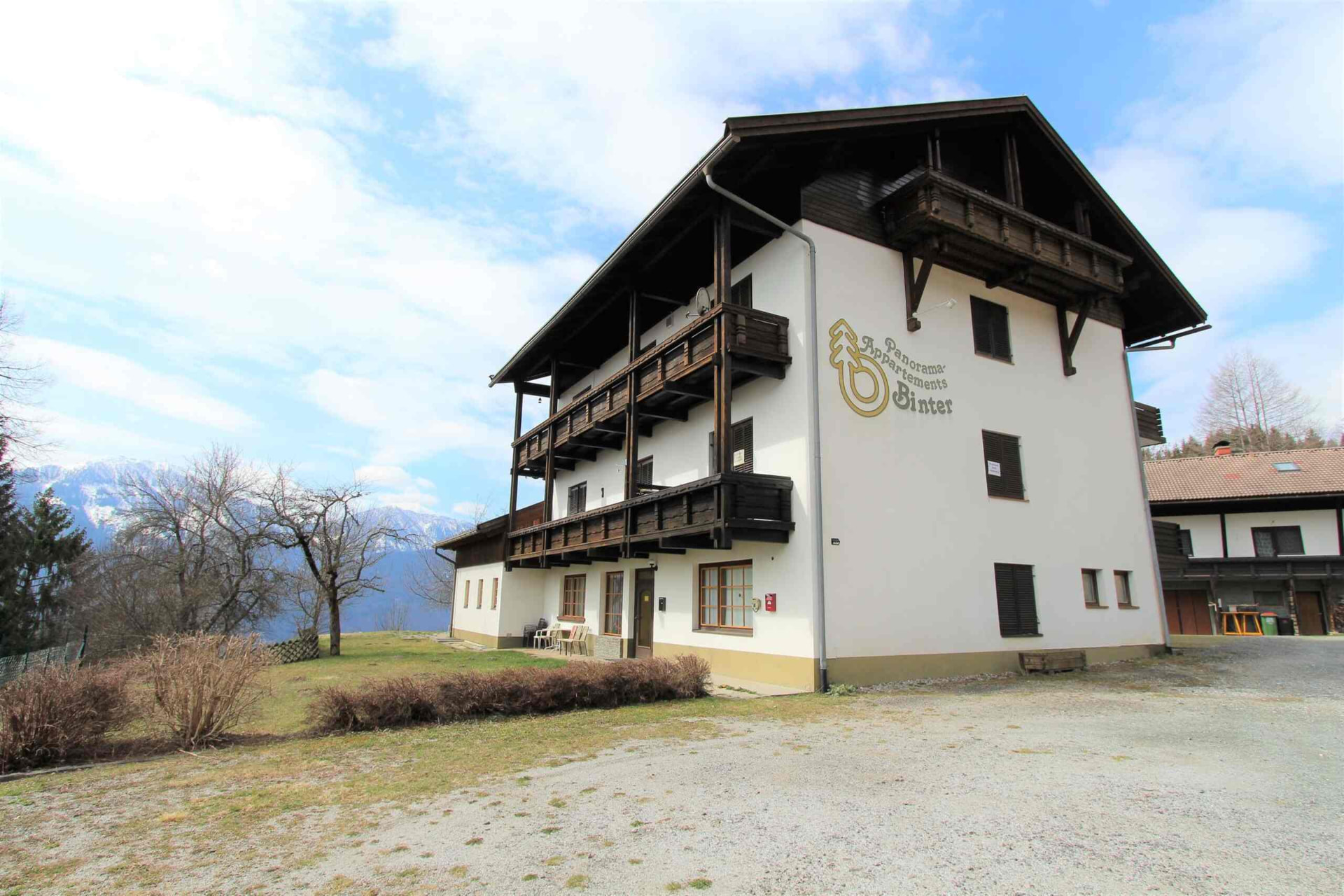 Panorama Appartements Binter chalet with wooden balconies and mountain backdrop